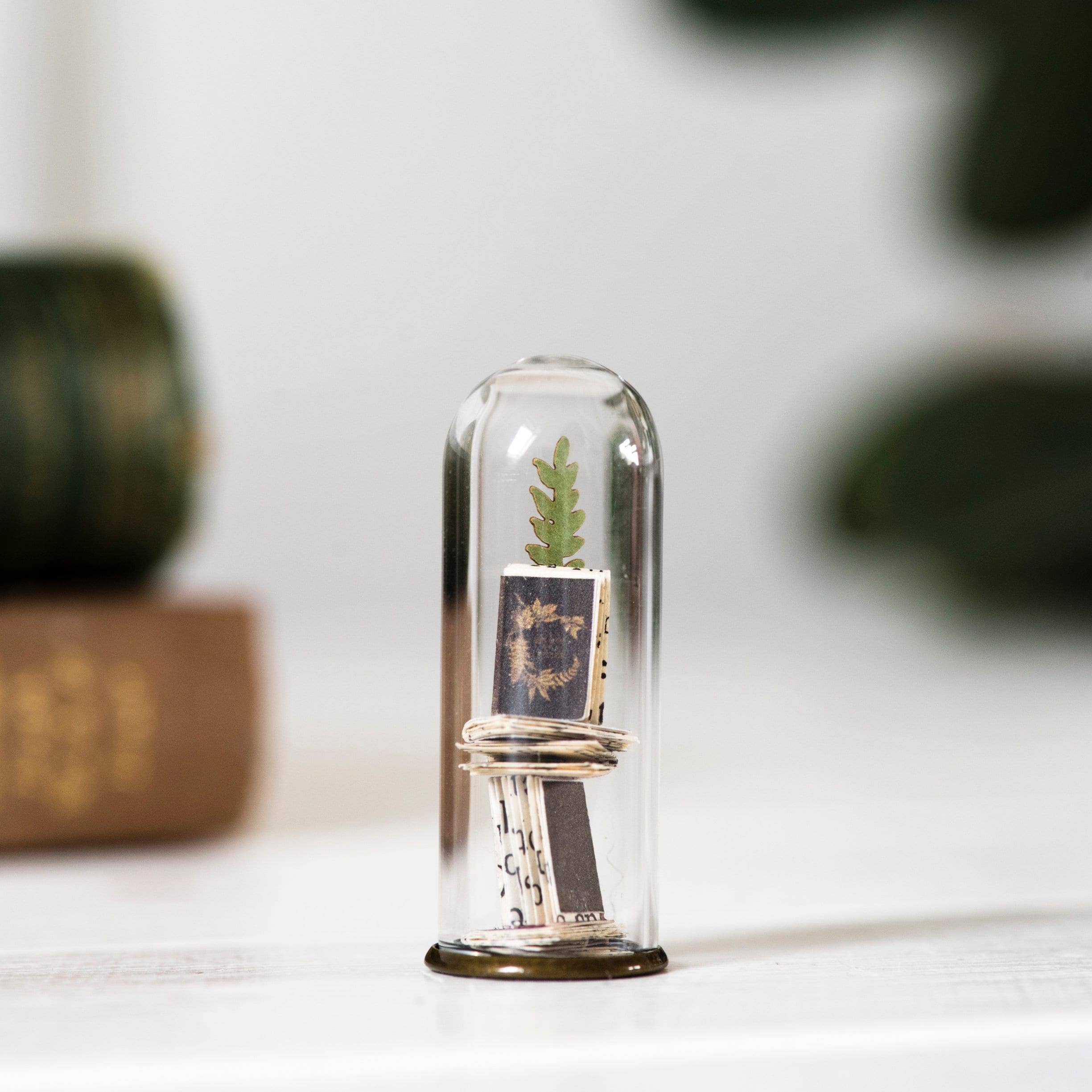 Book and plant miniature sculpture
