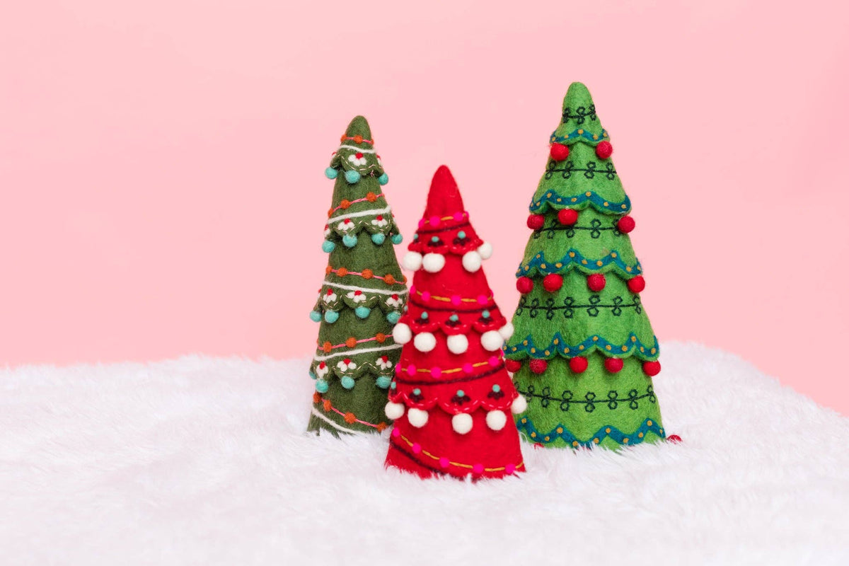 The three sugar plum tree sizes, 9, 9 3/4 and 11 inches, grouped together