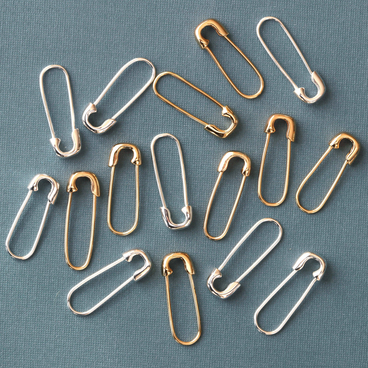 Safety Pin Hoop Earrings in sterling silver worn close to the ear