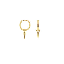 Close cropped photo of a gold spike charm hoop worn on the ear